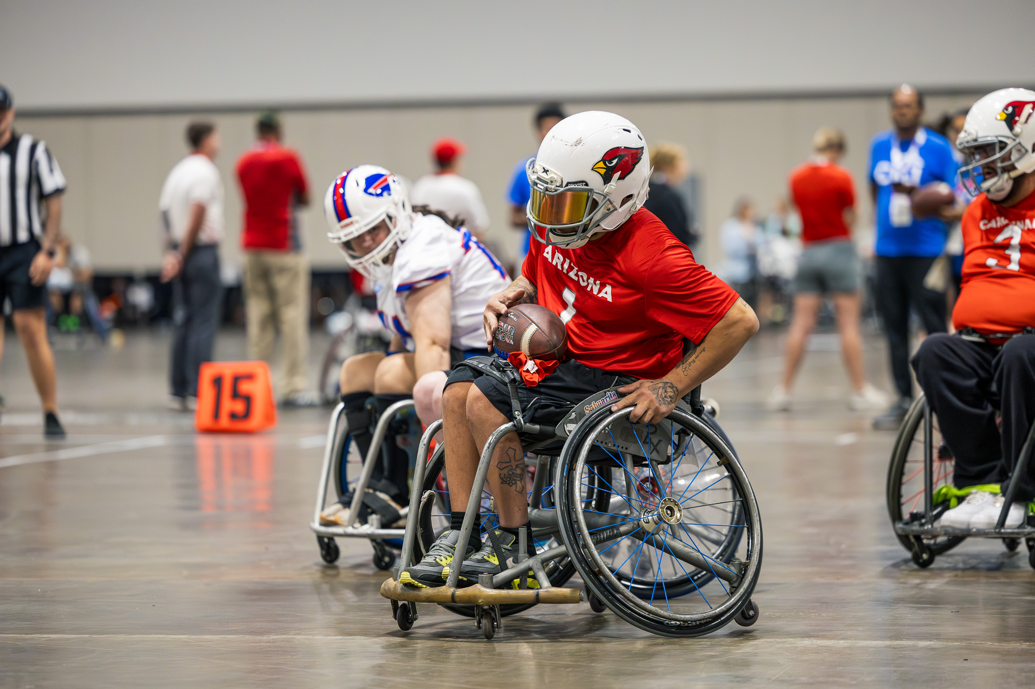 USAWFL arizona cardinals athlete pushing downfield while a buffalo bills athlete chases