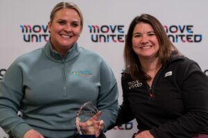 Amie Day accepts award from Jessie Cloy