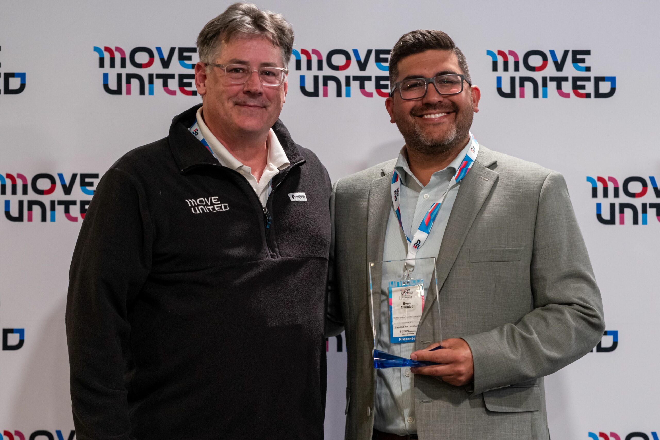 Move United CEO Glenn Merry presents award to USTA Evan Enquist