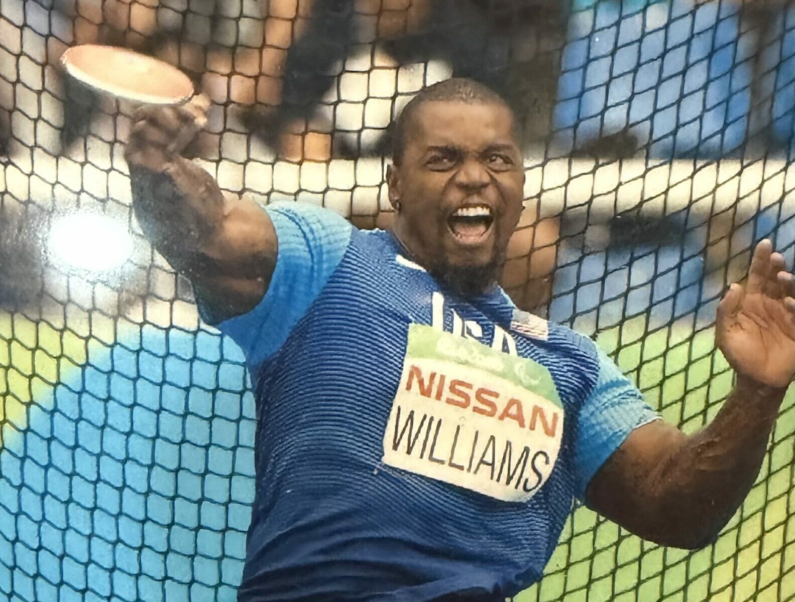 Johnnie Williams throwing a discus