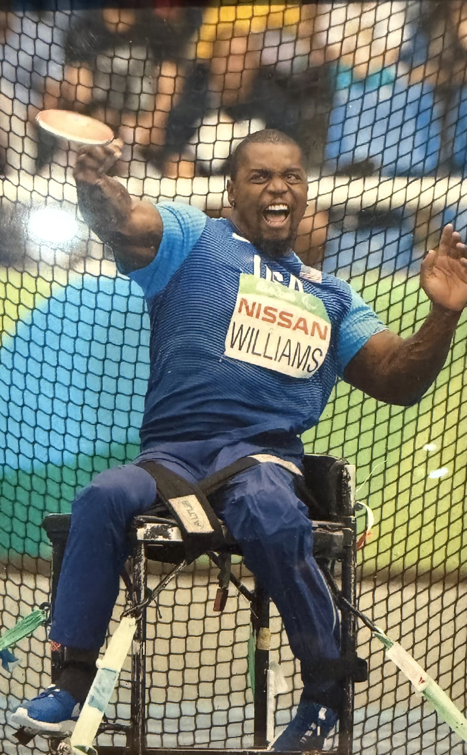 Johnnie Williams throwing a discus