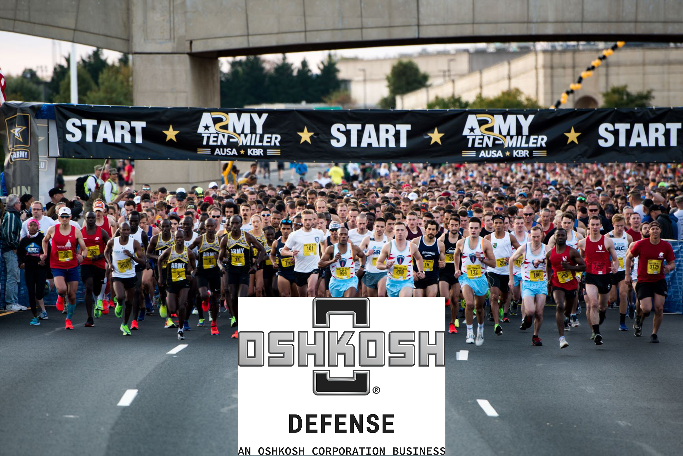 Army Ten-Miler runners running towards the camera with the start line behind them and Oshkosh Defense logo in the foreground.