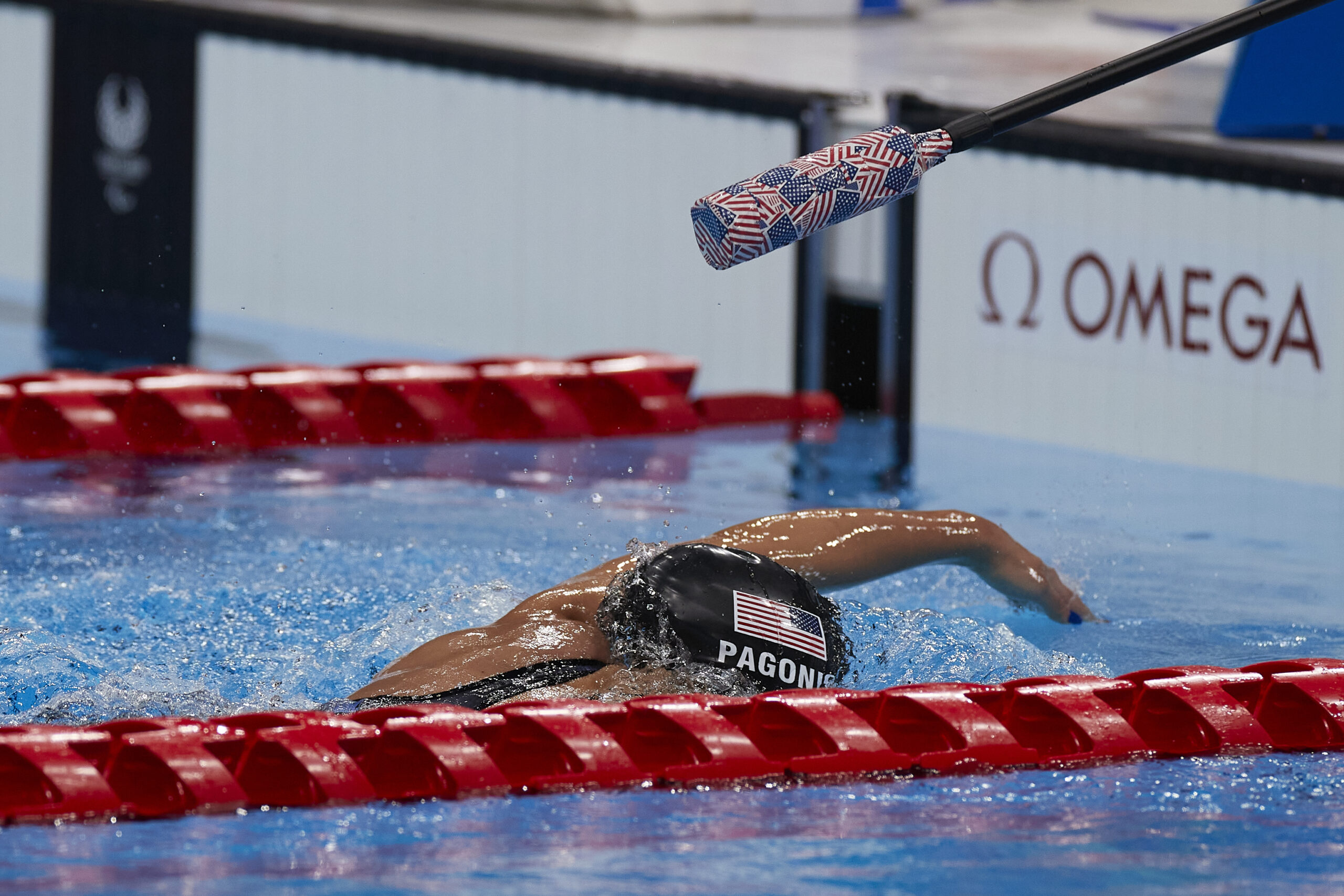 Anastasia Pagonis nearing the end of the pool while competing in a swim meet