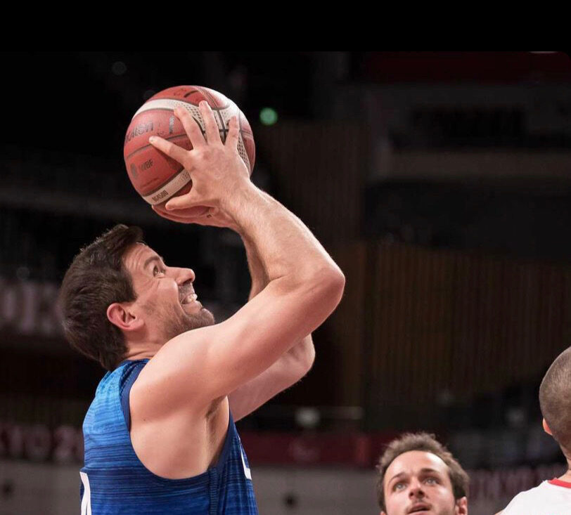 Josh Turek getting ready to shoot the ball in a wheelchair basketball game for Team USA