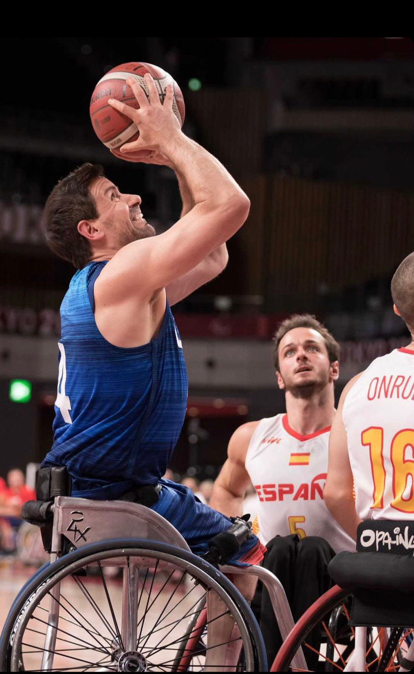 Josh Turek getting ready to shoot the ball in a wheelchair basketball game for Team USA
