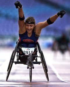Cheri Madsen wheelchair racing on the track
