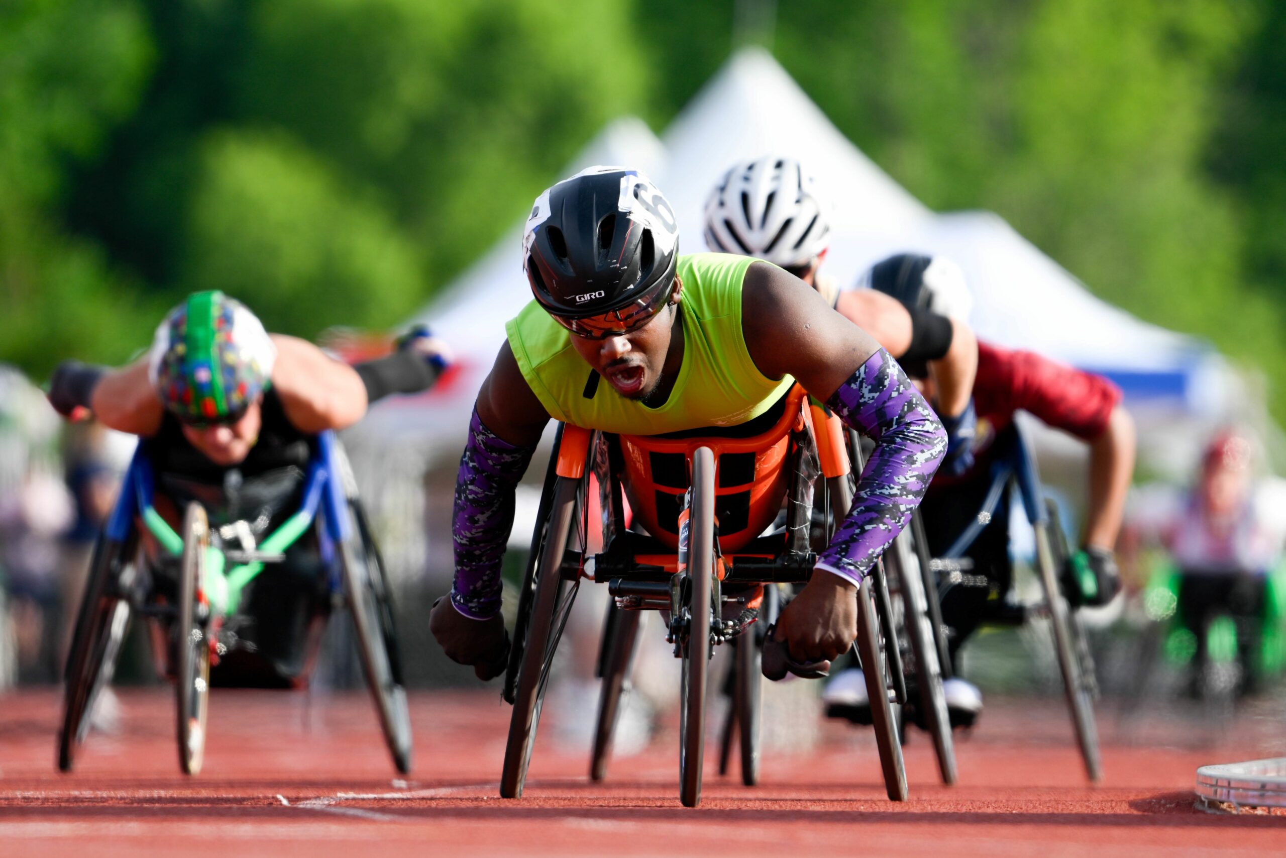 Wheelchair racers at the finish of a race on a track