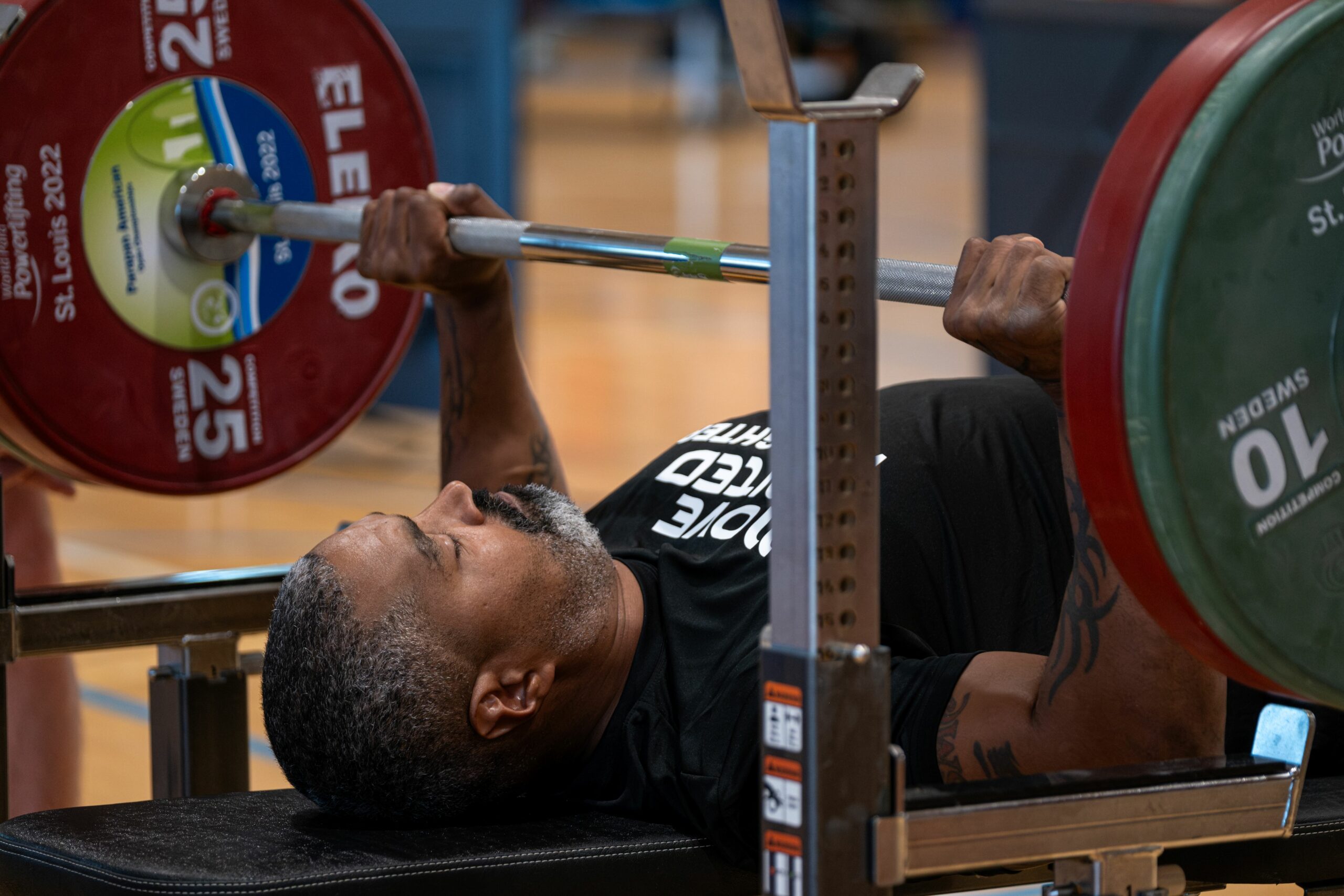 Powerlifter on the bench with the bar getting ready to press