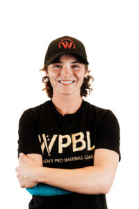 Brittany posing for the camera, smiling, wearing her WPBL gear