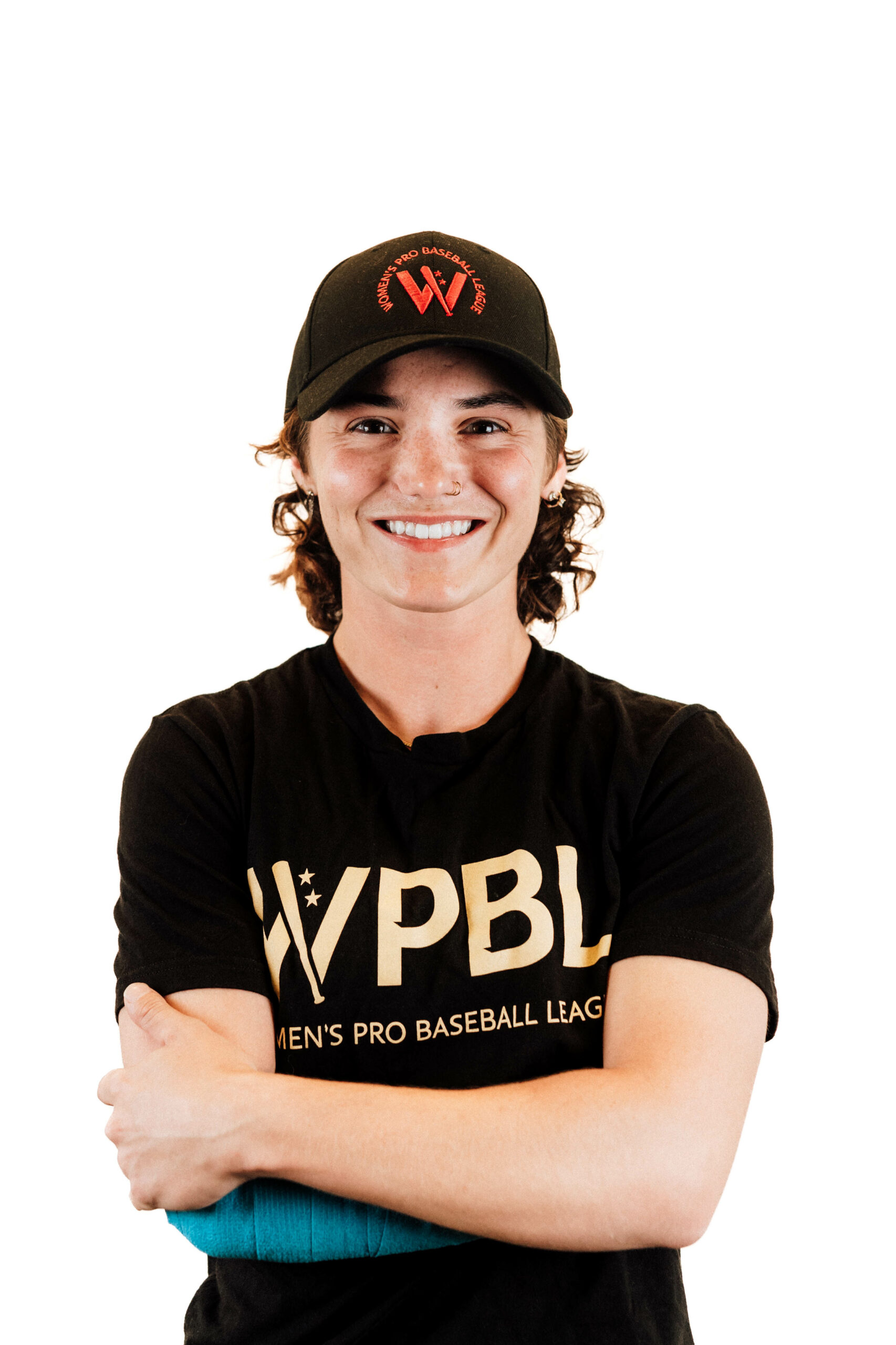 Brittany posing for the camera, smiling, wearing her WPBL gear